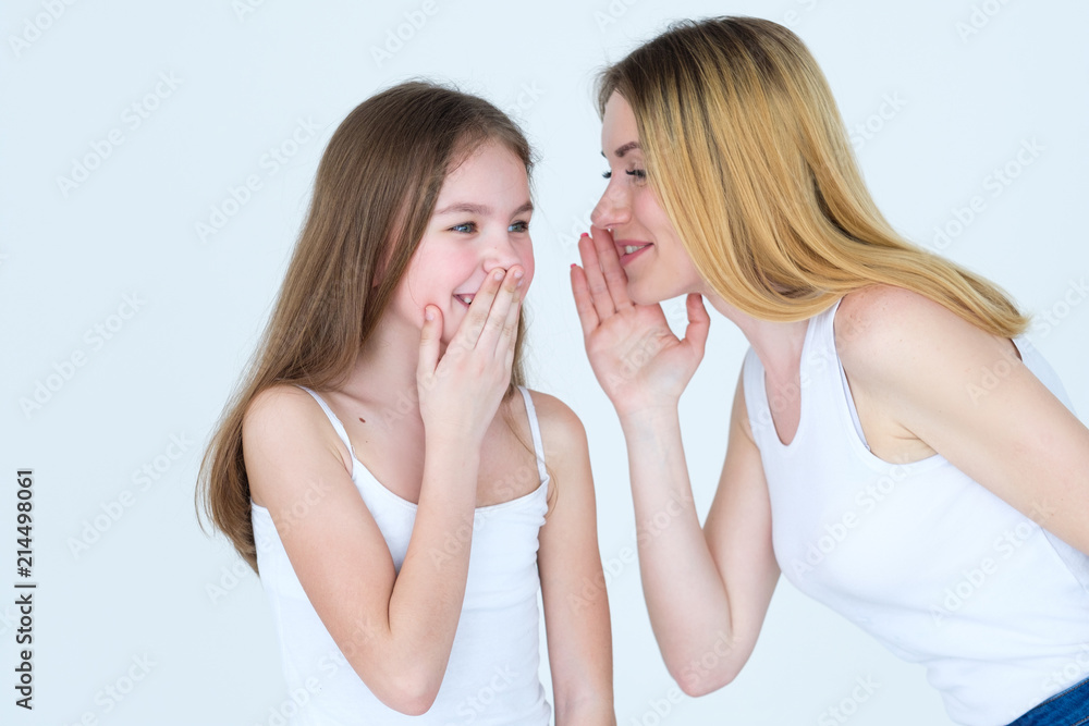 mother and daughter gossiping. family communication bff and friendship. mom and child bond and trusting relationship