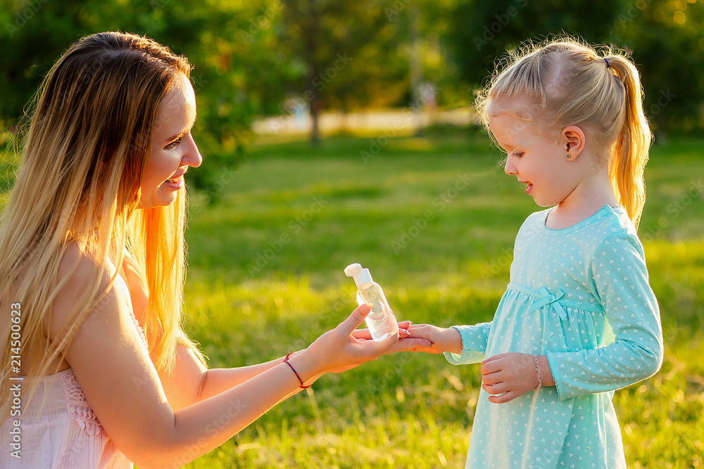 cute little blonde girl daughter in a blue dress with beautiful long ...