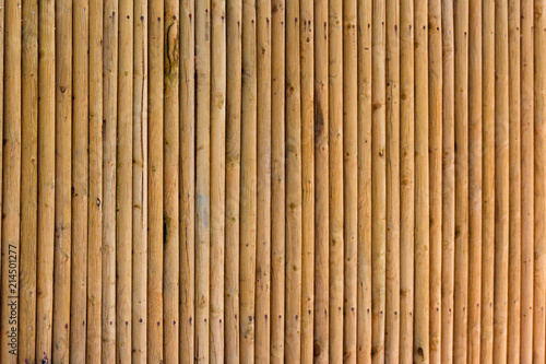 Close up of textured yellow privacy bamboo screen fence  made from natural organic materials