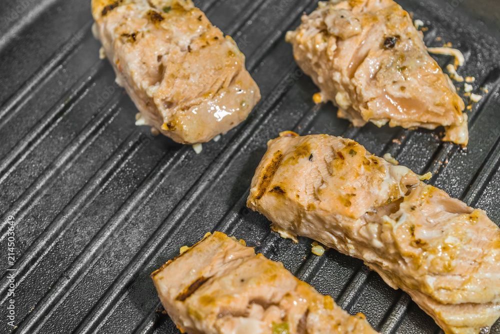 Slices of roasted salmon in a grill pan Slices of roasted salmon in a grill pan