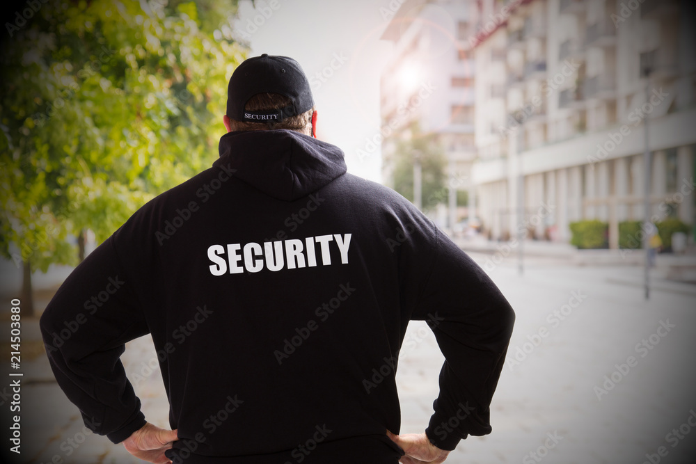 security man in a sunny day checking the city security man in a sunny day checking the city