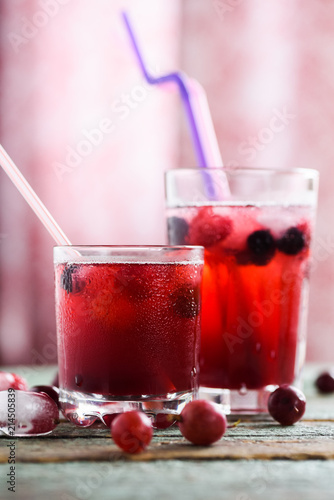 Wallpaper Mural Refreshing non alcoholic beverage. Sangria, cold drink of cherry juice and soda with ice on blue background Torontodigital.ca