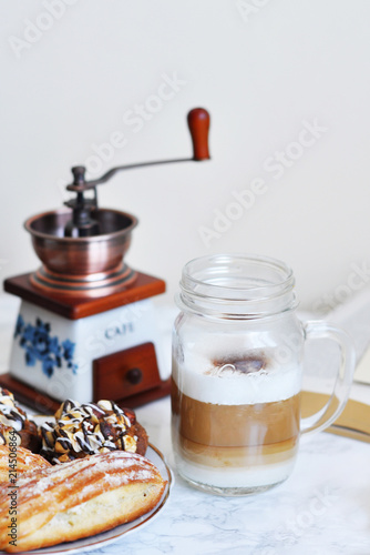 jar of coffee, coffee mill and desserts