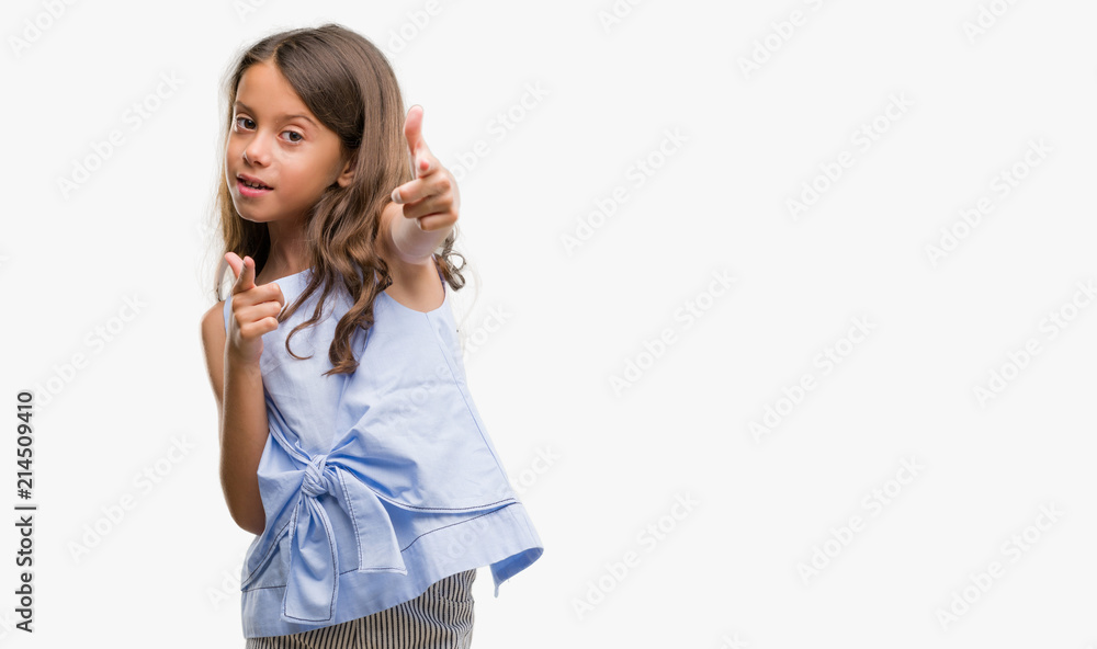 Brunette hispanic girl pointing fingers to camera with happy and funny face. Good energy and vibes. Brunette hispanic girl pointing fingers to camera with happy and funny face. Good energy and vibes.