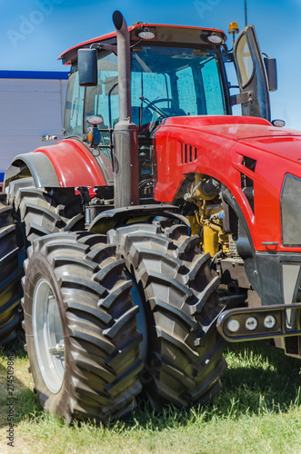 modern tractor for agriculture on the farm with a powerful motor, the flagship of the modern agricultural industry
