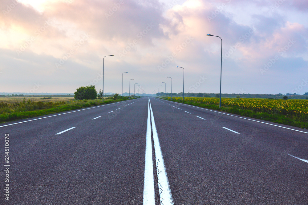an empty road at dawn an empty road at dawn
