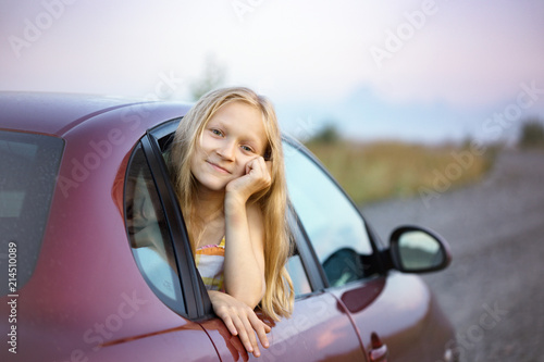 girl looking out the car