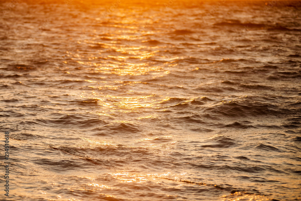 One boat floating in the ocean during the sunrise. One boat floating in the ocean during the sunrise.