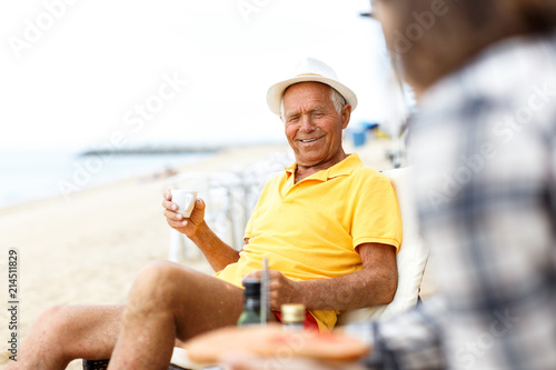 Man sitting with cup of hot drink