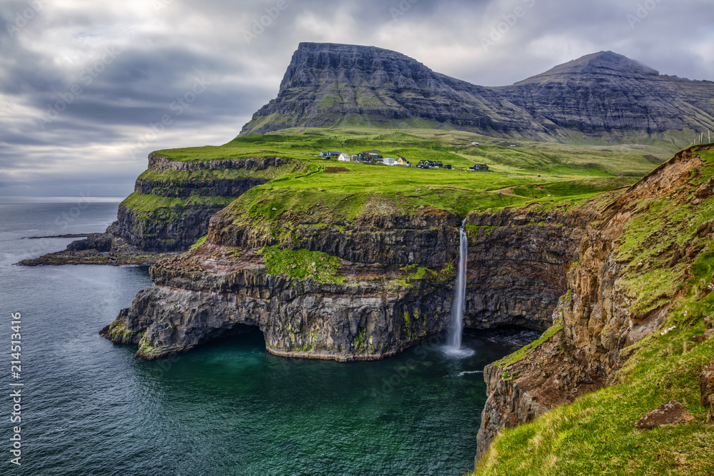 Gasadalur village and Beautiful  waterfall,  Vagar, Faroe Islands, Denmark.  - obrazy, fototapety, plakaty 