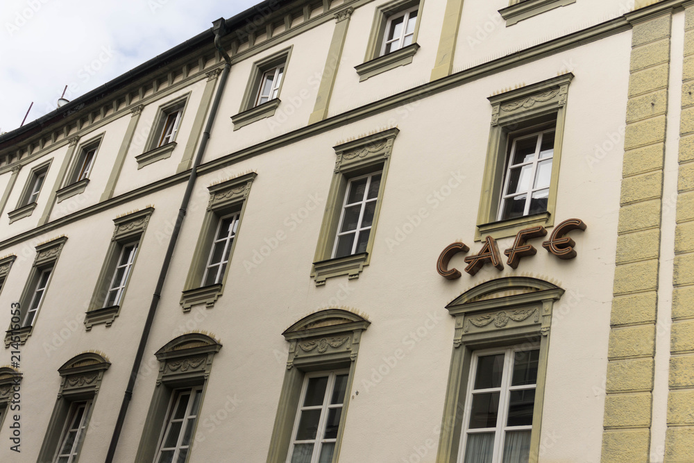 Cafe sing on building facade