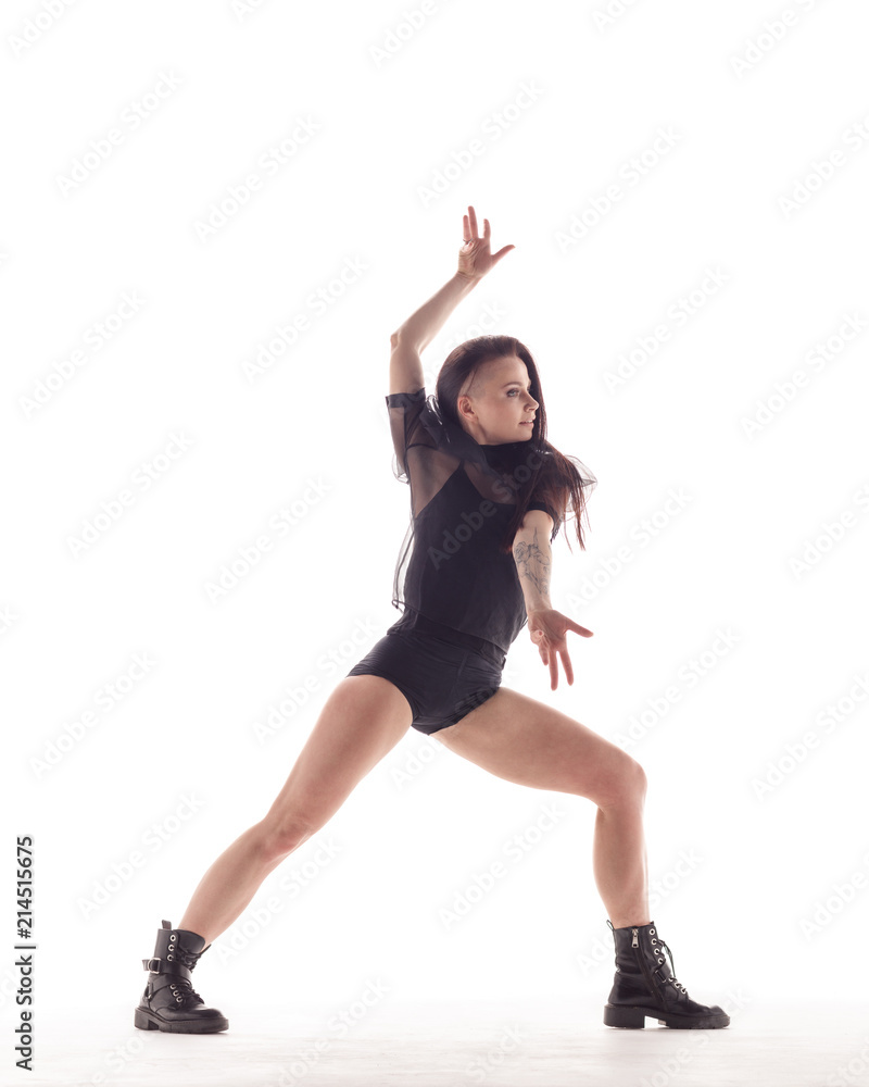 Young beautiful dancer is posing in studio Young beautiful dancer is posing in studio