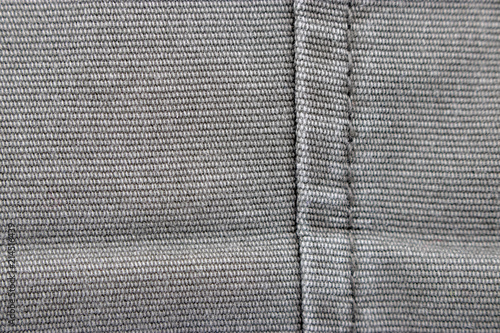 grey fabric texture with a singel seam on the right side