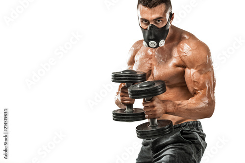 Brutal strong muscular bodybuilder athletic man pumping up muscles in training mask on white background. Workout bodybuilding concept. Copy space for sport nutrition ads.