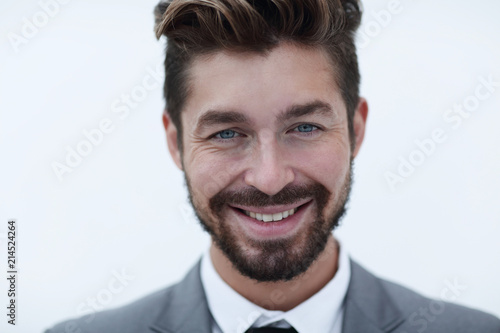 Serious businessman wearing suit and tie. blue background