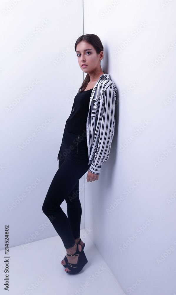 young woman leaning on wall. young woman leaning on wall.