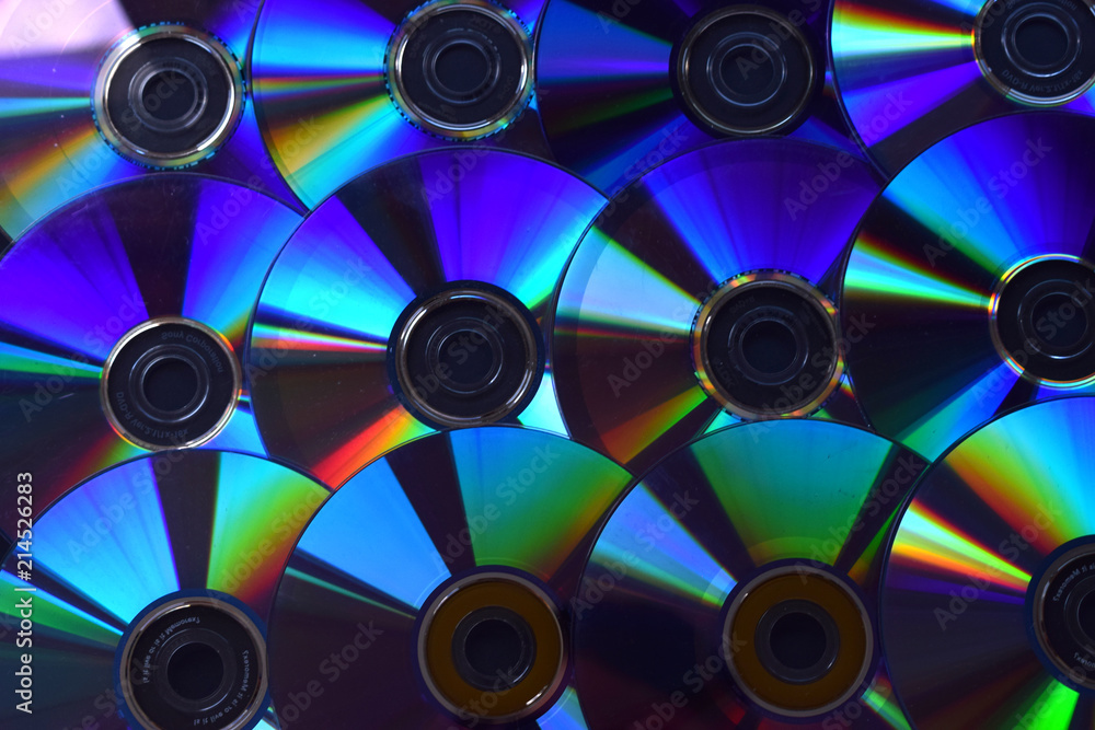Fondo de discos de DVD y CDs iluminados. Fondo de discos de DVD y CDs iluminados.