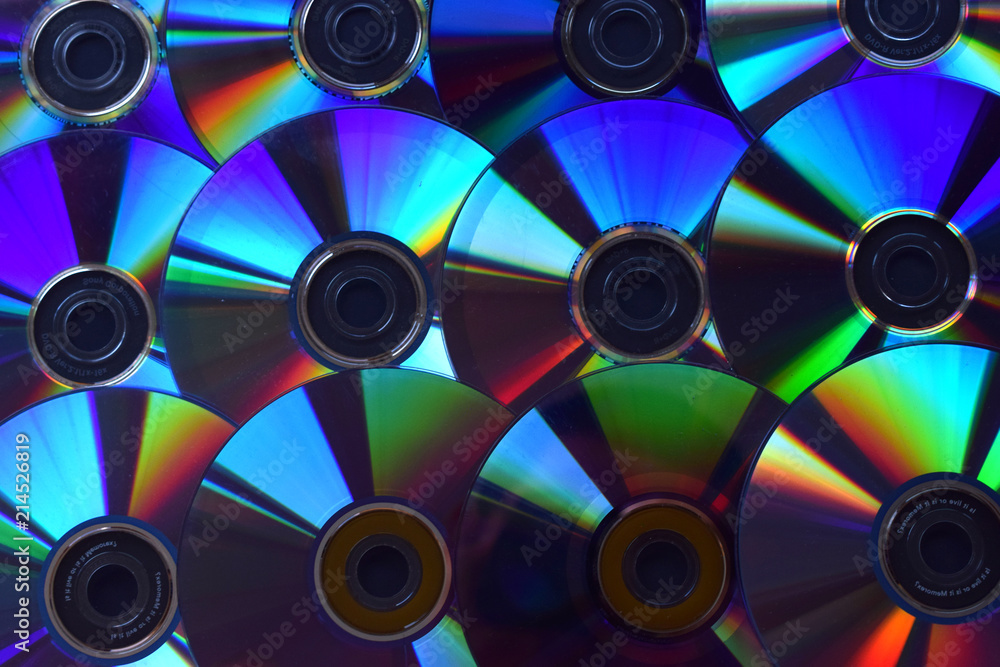 Fondo de discos de DVD y CDs iluminados. Fondo de discos de DVD y CDs iluminados.
