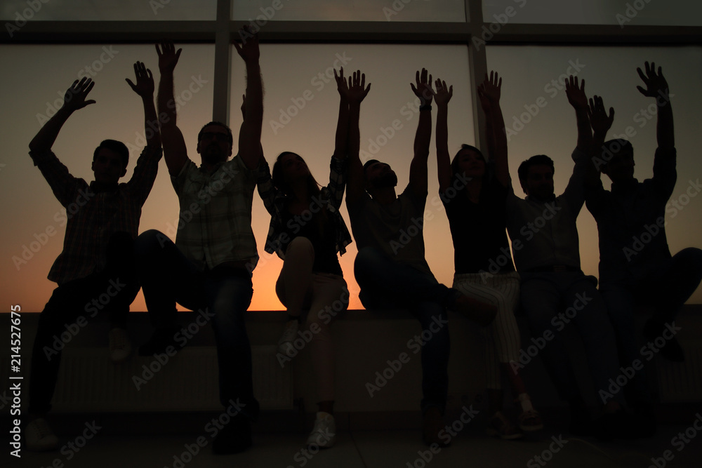 Fototapeta premium business team sitting on the windowsill in the office.