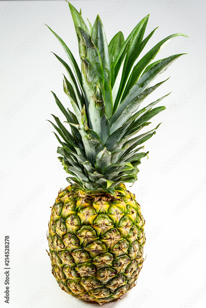 Pineapple on a table waiting for the chef to carve it and serve Pineapple on a table waiting for the chef to carve it and serve