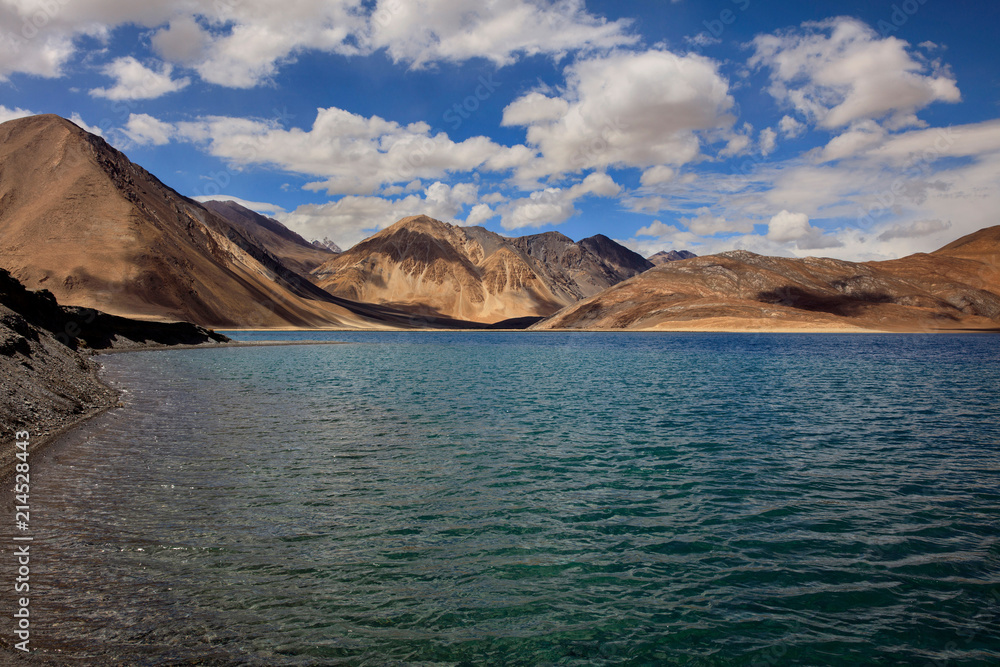 Pangong Tso - Pangong Lake, located near the border between India and Tibet - Holy beautiful pure turquoise blue lake, exotic landscape in Ladakh India. High Altitude Lake over 4000 meters Pangong Tso - Pangong Lake, located near the border between India and Tibet - Holy beautiful pure turquoise blue lake, exotic landscape in Ladakh India. High Altitude Lake over 4000 meters