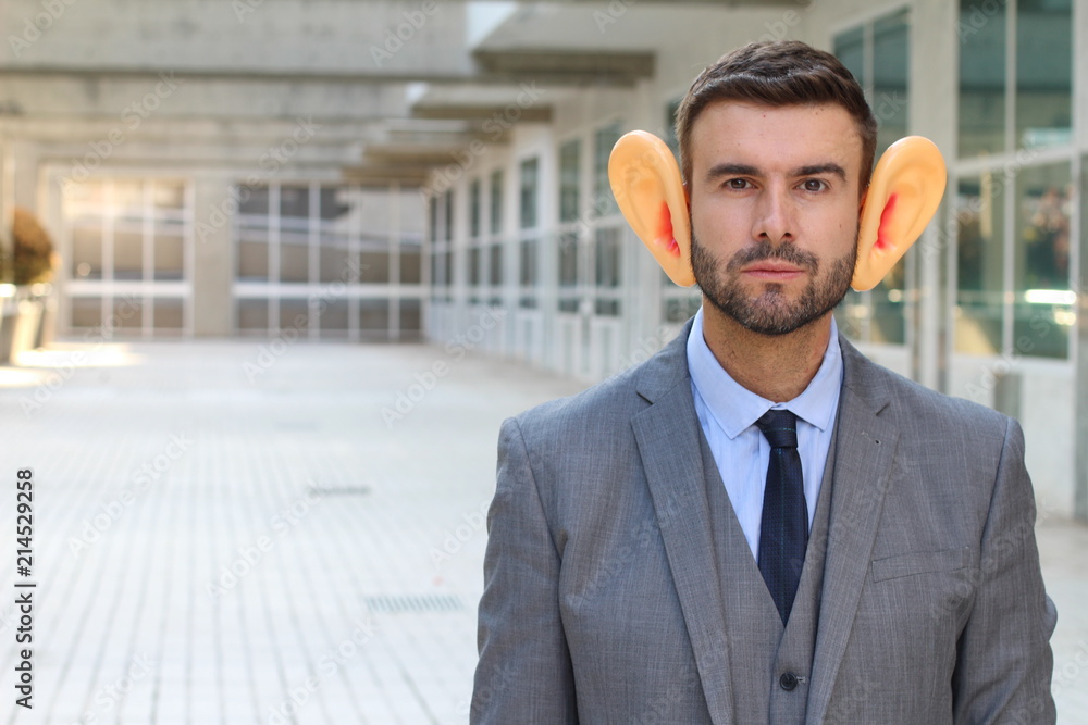 Big-eared businessman in office space 