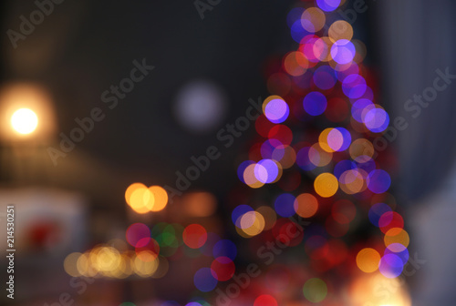 Blurred view of stylish room interior with decorated Christmas tree