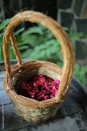 Woven Wicker Basket of Dried Red Pink Rose Petals for scattering flower petals at a Wedding