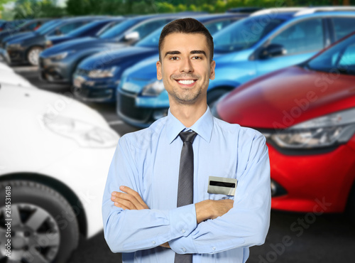 Portrait of salesman near c...