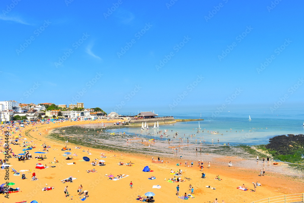 Tourists on their summer holidays. Viking beach in the coastal town of Broadstairs, Kent county gets really busy during the summer school holidays. Broadstairs, Kent, UK