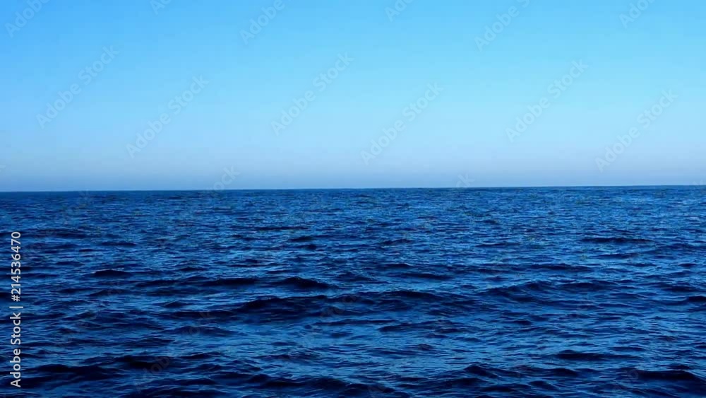 view from a sailboat far off the see along the atlantic coast of europe view from a sailboat far off the see along the atlantic coast of europe