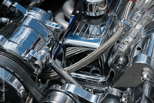 Close up of Chrome Engine Parts, Hoses and Belts on a High Performance Engine