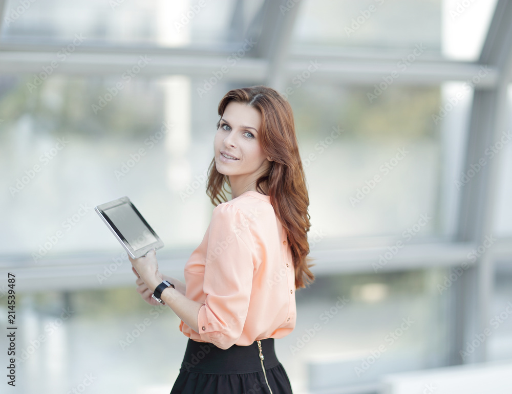 side view.confident business woman with digital tablet side view.confident business woman with digital tablet