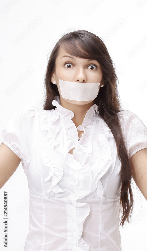portrait of young business woman with taped mouth