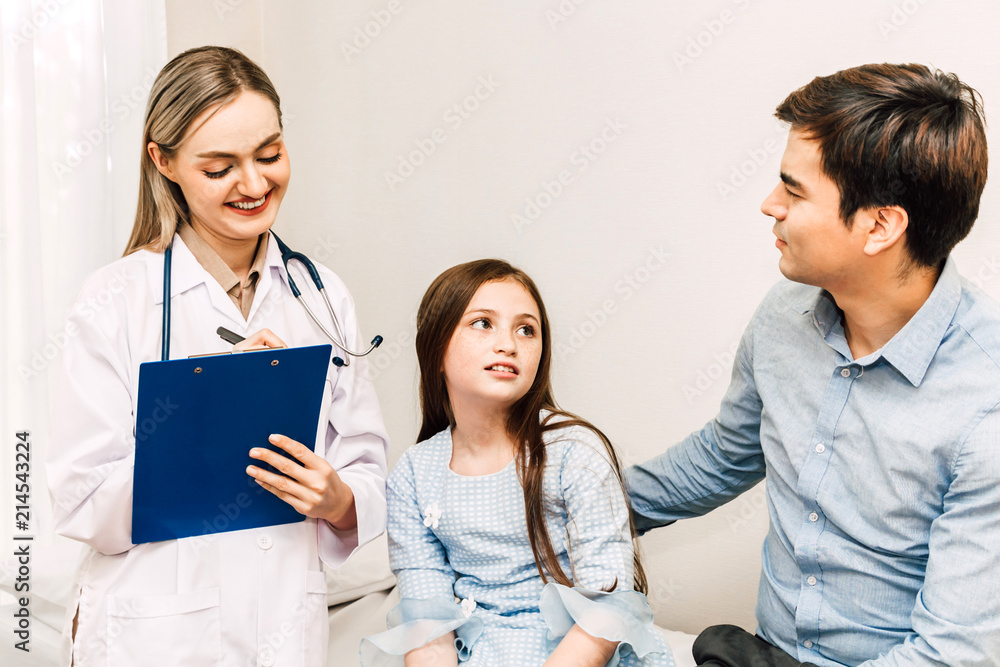 Doctor consulting and check up information with little girl in hospital.A little girl has sick.healthcare and medicine Doctor consulting and check up information with little girl in hospital.A little girl has sick.healthcare and medicine
