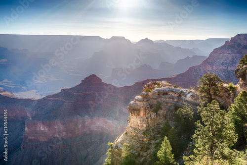 Man Is Seating On The Edge of Cliff and Watching of Sunrise at Grand Canyon from Mather Point