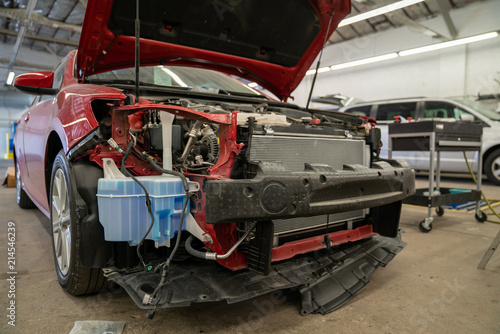 Wrecked car in repair shop © Jordan Loscher
