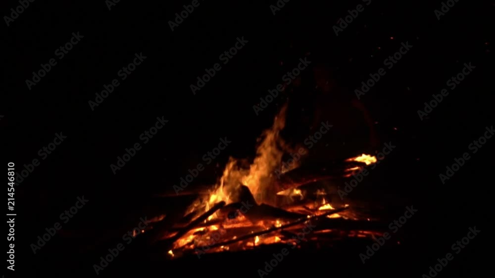 The person jumps through fire. Holiday. The person jumps through fire. Holiday.