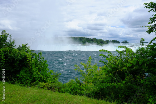 Mist and spray rising over the water falling into Niagara Falls