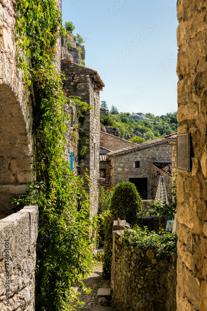 View through a small romantic alley in the old medieval village Labeaume in France