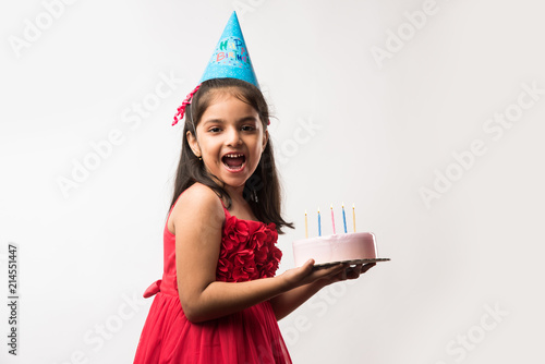 Photography Cute adorable little Indian/asian small girl celebrating birthday while holding