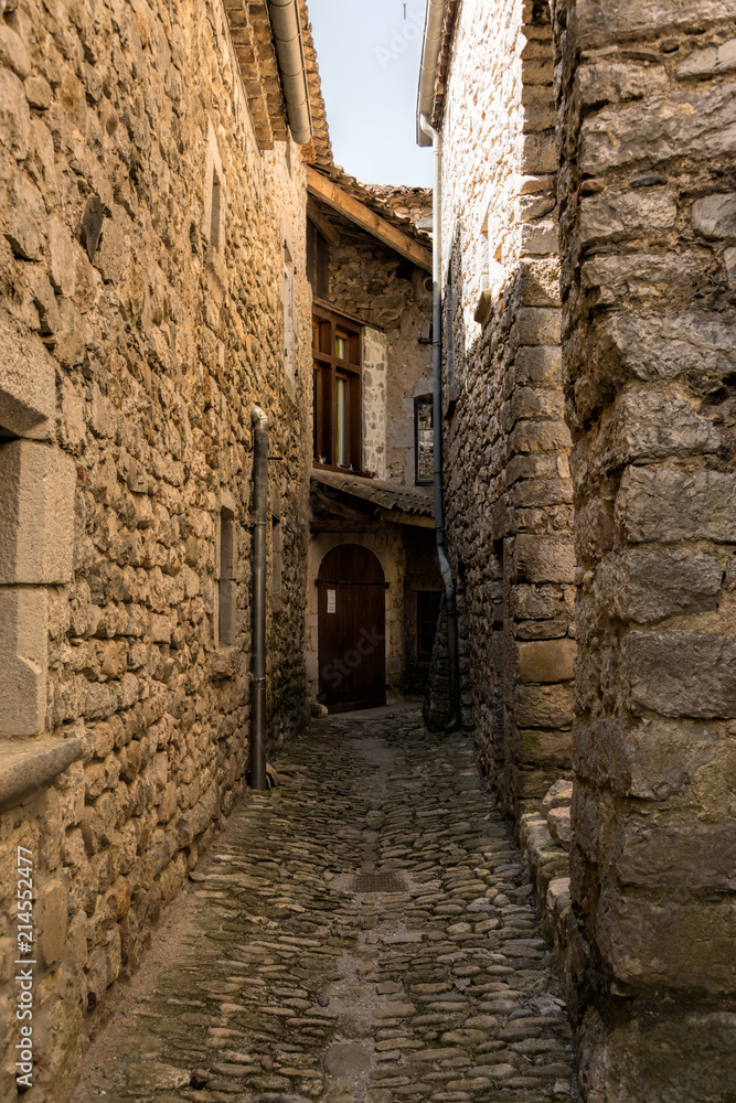 Romantic and very small alley between the houses in the old medieval village Labeaume in France