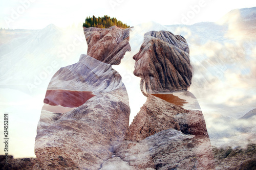 Canvas Print Double exposure man and woman couple hugging with mountains in background