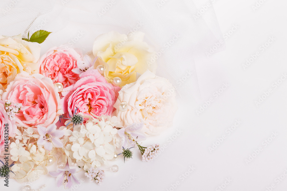 Sweet color fabric roses and white ribbon in soft style for background. Overhead top view, flat lay. Copy space. Wedding, Birthday, Mother's, Valentines, Women's Day concept