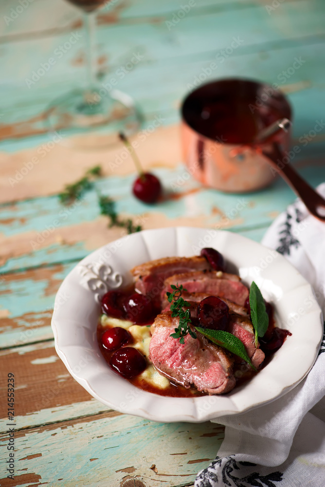 Duck breast with cherry sauce and polenta.style rustic Duck breast with cherry sauce and polenta.style rustic
