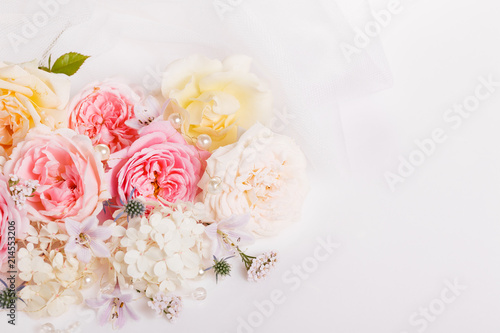 Sweet color fabric roses and white ribbon in soft style for background. Overhead top view, flat lay. Copy space. Wedding, Birthday, Mother's, Valentines, Women's Day concept