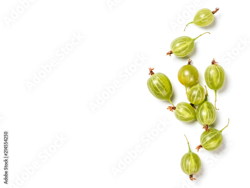 Heap of ripe green gooseberry berries on white background. Creative layout made of organic gooseberries. Isolated on white with clipping path. Top view or flat lay. Copy space for text. Food concept. photo