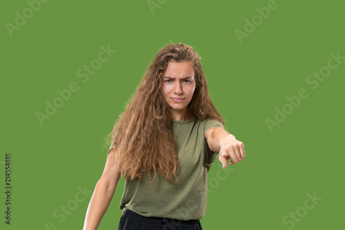 The overbearing business woman point you and want you, half length closeup portrait on green background. © master1305