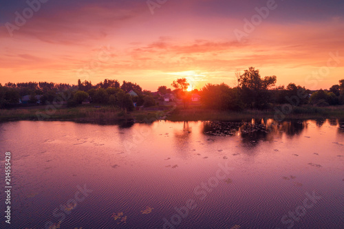 Magical purple sunrise over lake. Misty morning, rural landscape, wilderness © vvvita