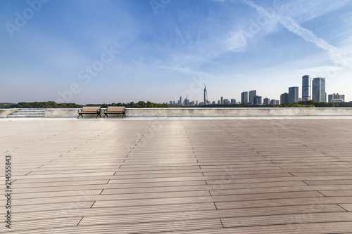 Panoramic skyline and modern business office buildings with empty road,empty concrete square floor